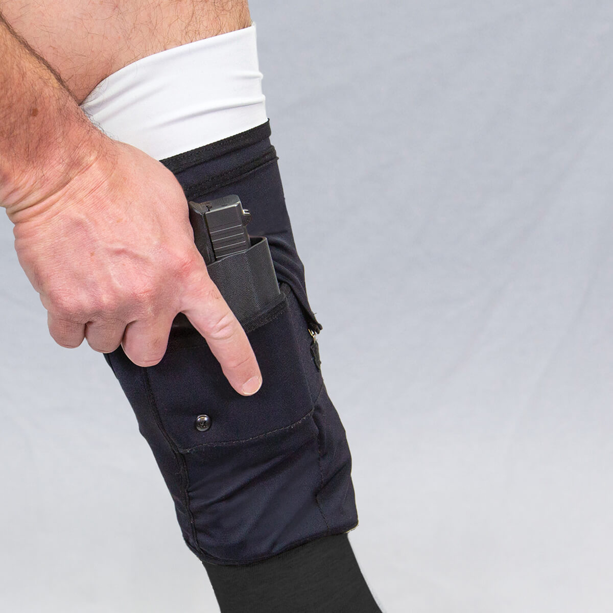470744_Mid-Calf_Gun-Sox-Pro_with-hand_Side-view_Front-Cover